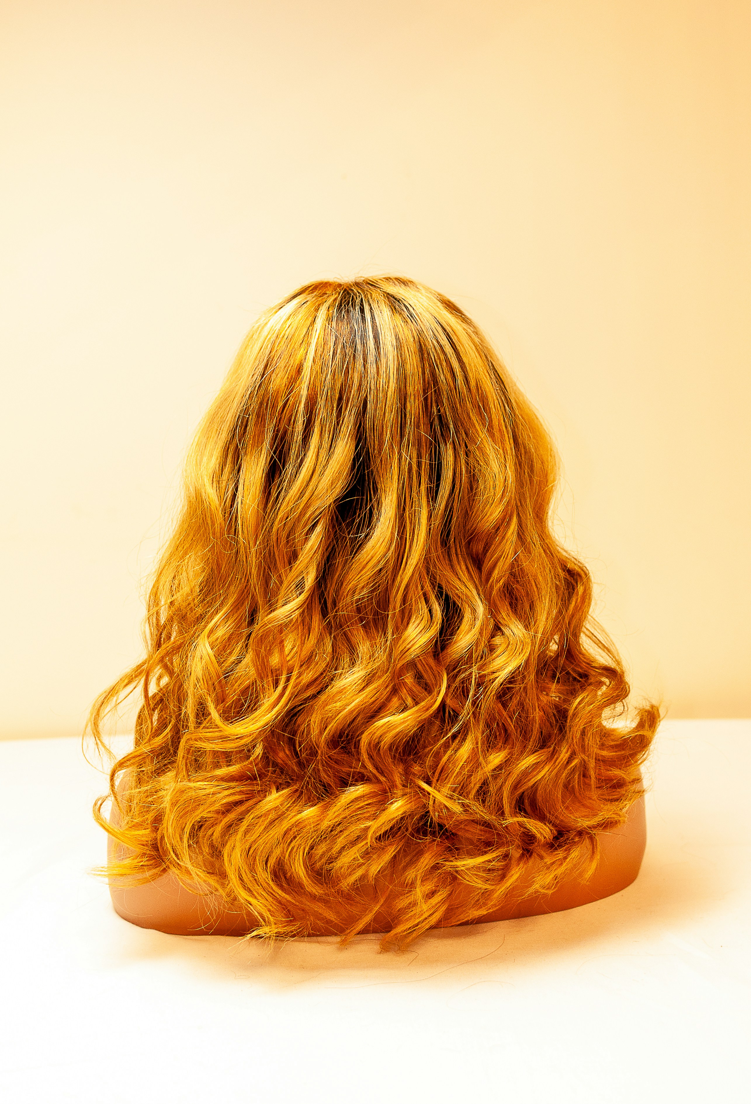 Long blonde hair extensions adding length and fullness at Kiki's Cuts and Curls in Maplewood, Virginia
