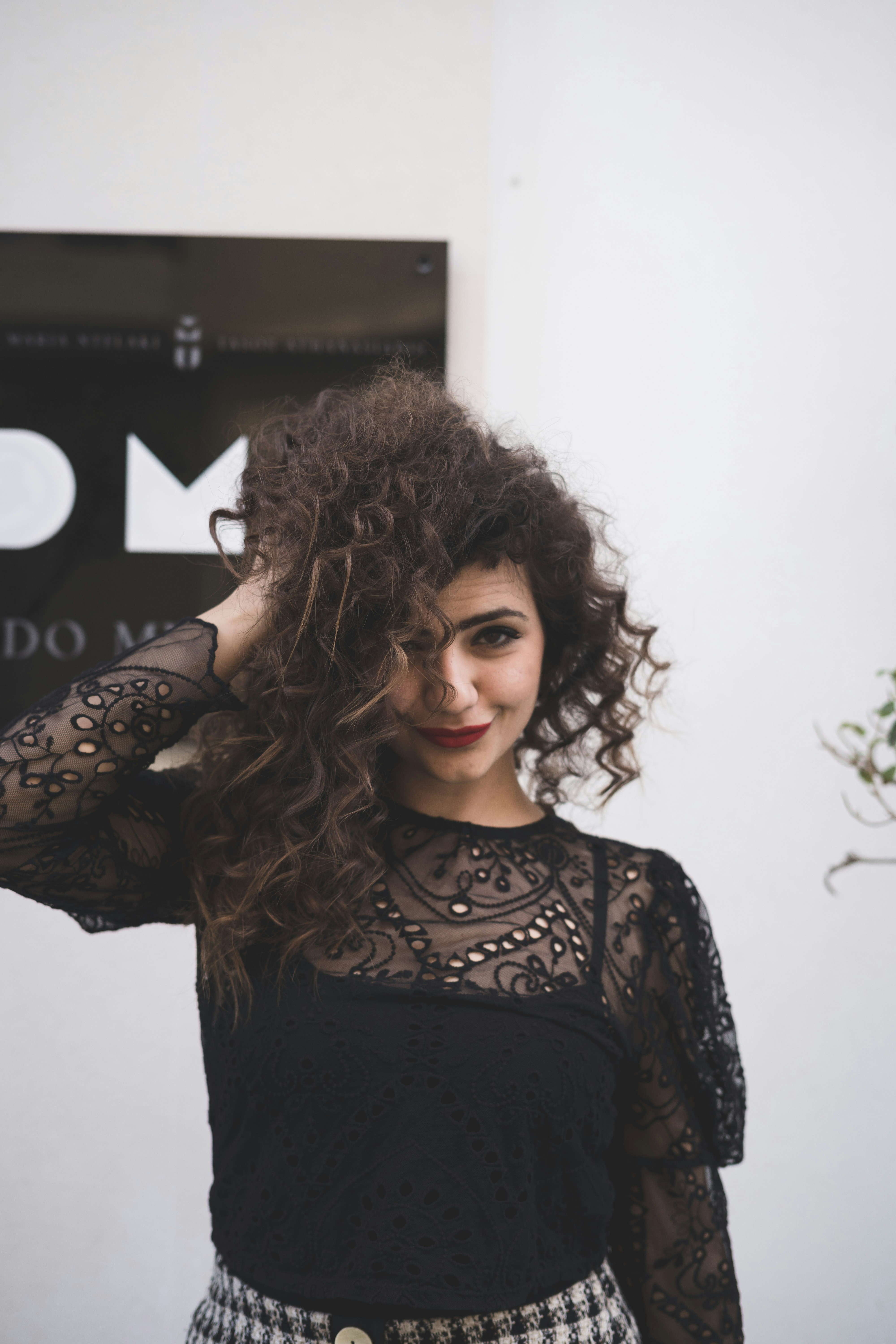 Dark wavy hair cut and styled at Kiki's Cuts and Curls in Maplewood, Virginia