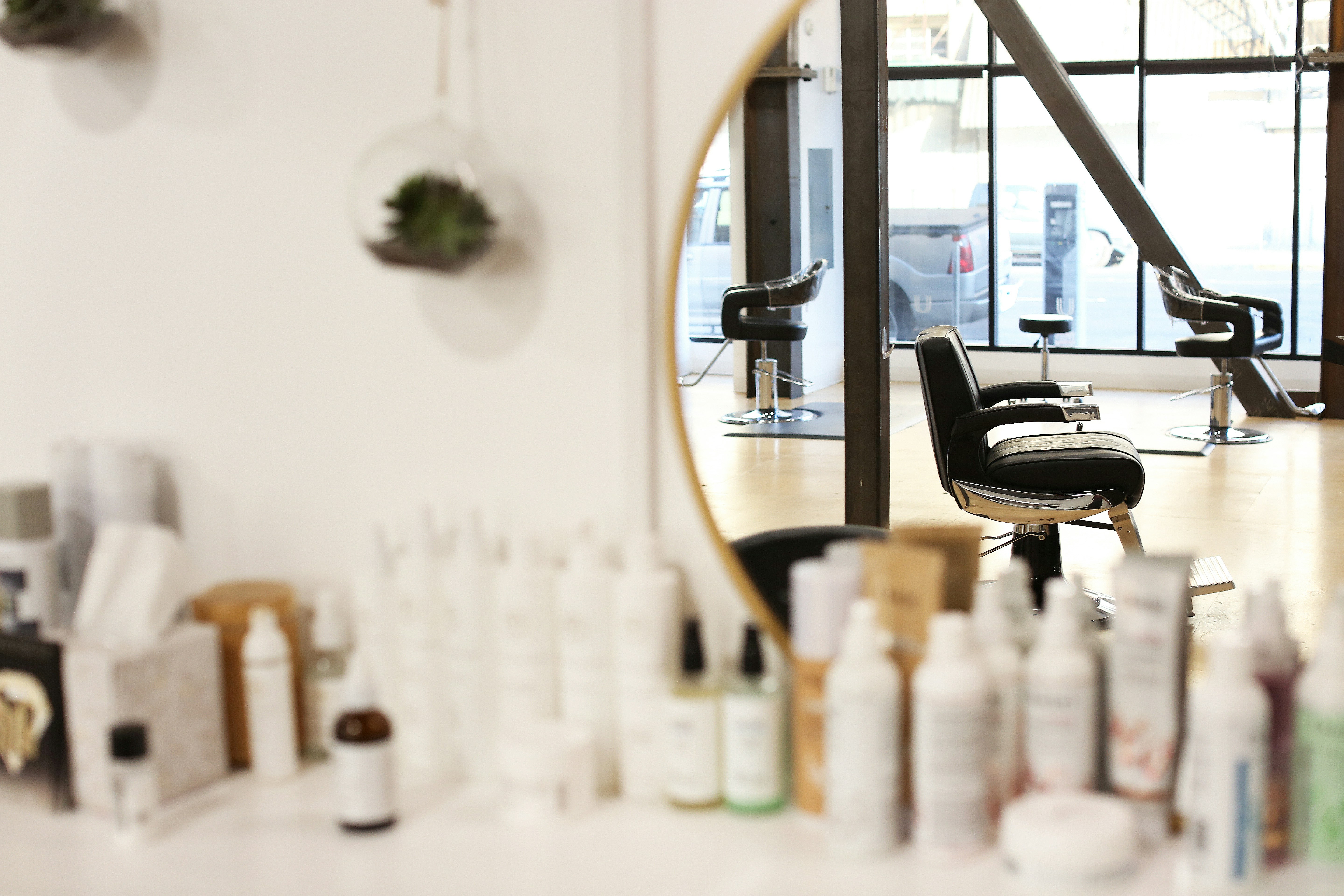 Hair care products on a shelf inside Kiki's Cuts and Curls salon in Maplewood, Virginia